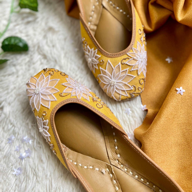 Organza flowers, katdana and pearls embellished handcrafted mustard juttis for Women.