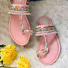 Stylish Pink Kolhapuris embroidered delicately with pearls, beads and sequins.