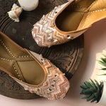 Handcrafted beautiful pastel pink juttis embroidered with sequins, pearls, tassels and katdana for women.