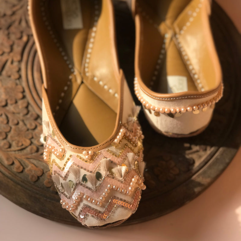 Handcrafted beautiful pastel pink juttis embroidered with sequins, pearls, tassels and katdana for women.