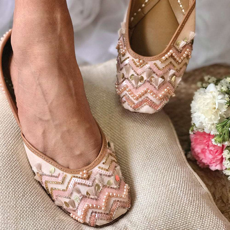 Handcrafted beautiful pastel pink juttis embroidered with sequins, pearls, tassels and katdana for women.