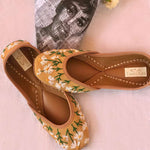 Ethnic handcrafted hand-embroidered mustard juttis with beautiful thread work white flowers for women.