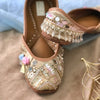 Handcrafted beautiful lustrous gold juttis embroidered with mirrors, sequins, pearls, tassels and katdana for women.