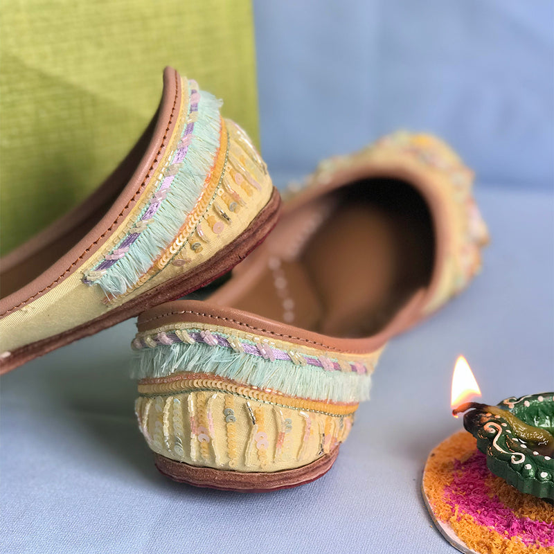 Stylish handcrafted lemon juttis hand-embroidered using sequins, katdana and beadwork.