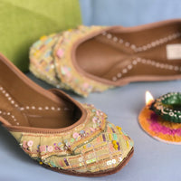Stylish handcrafted lemon juttis hand-embroidered using sequins, katdana and beadwork.