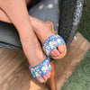 Stylish handcrafted sliders on a denim base hand-embroidered using sequins, threadwork, pearls, and beadwork.