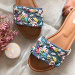 Stylish handcrafted sliders on a denim base hand-embroidered using sequins, threadwork, pearls, and beadwork.