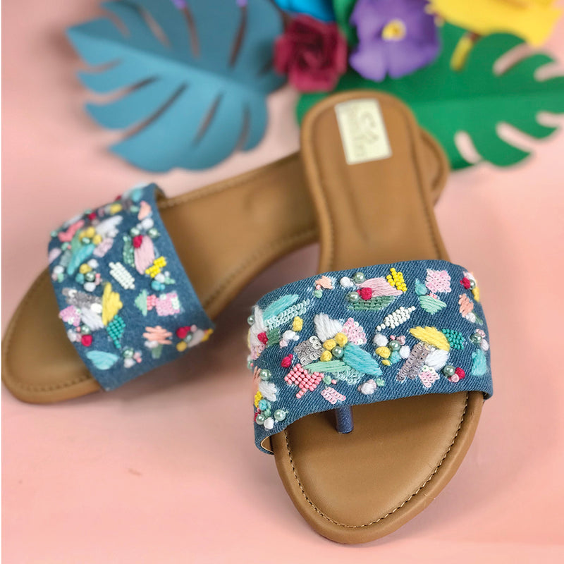 Stylish handcrafted sliders on a denim base hand-embroidered using sequins, threadwork, pearls, and beadwork.