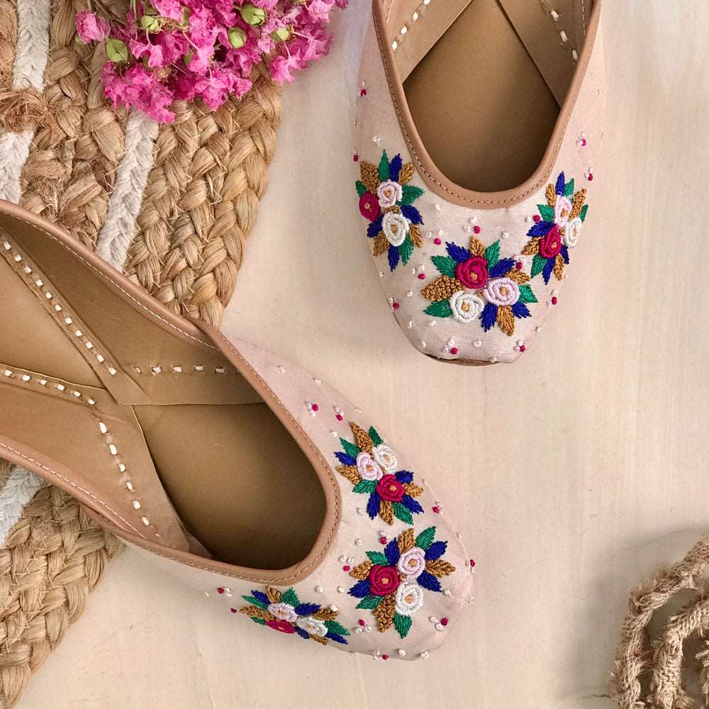 Handcrafted beautiful lustrous nude juttis embroidered with bullion and french knots for women.