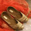 Ethnic handcrafted Golden juttis delicately hand-embroidered with premium quality sequins, golden pipes, crystals, dabka, beadwork, threadwork and katdana for women.