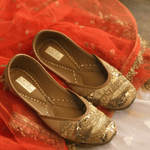 Ethnic handcrafted Golden juttis delicately hand-embroidered with premium quality sequins, golden pipes, crystals, dabka, beadwork, threadwork and katdana for women.