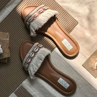 White and Beige stylish sliders embroidered with traditional sea shells and handcrafted laces.