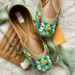 Ethnic handcrafted hand-embroidered green juttis with beautiful thread work flowers for women.