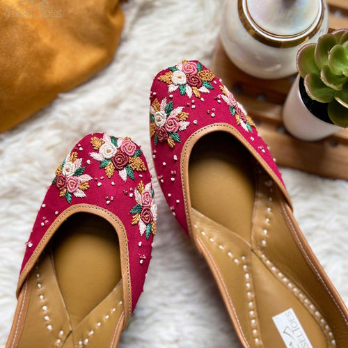 Handcrafted beautiful lustrous maroon juttis embroidered with bullion and french knots for women.
