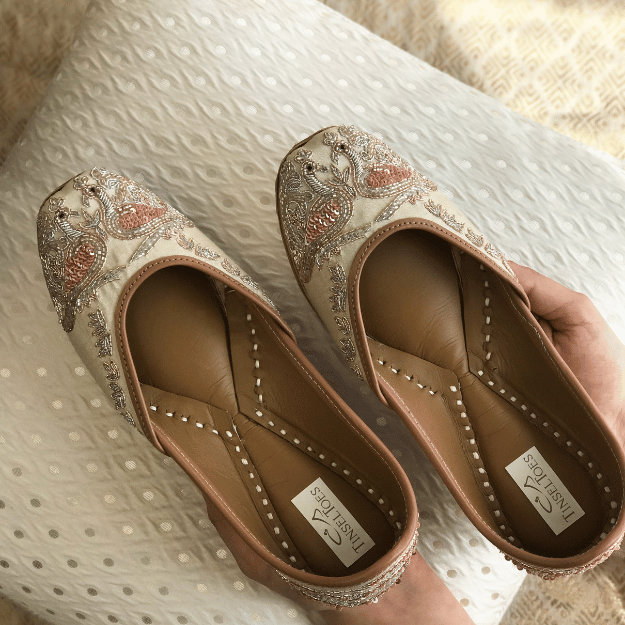Ethnic handcrafted hand-embroidered champagne juttis delicately embroidered with zardozi, dabka, katdana and sequins for women.
