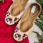 Handcrafted beautiful lustrous nude juttis embroidered with bullion and french knots for women.